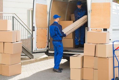 Furniture removals team planning a move in a Hackney residential street