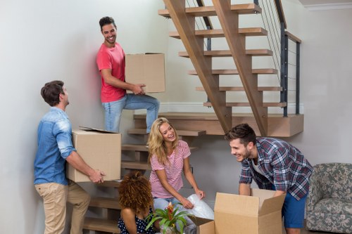 Removal team preparing for a Hackney home move with boxes and furniture