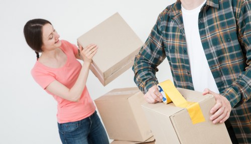 Moving boxes and furniture in a Hackney flat with stair access