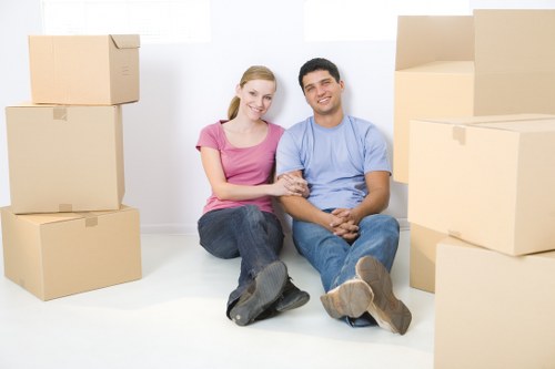 Local movers organising boxes for a residential move in Hackney