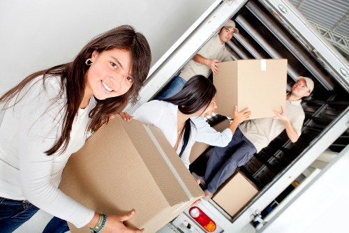Careful loading of sofas and tables for local furniture removals in Hackney