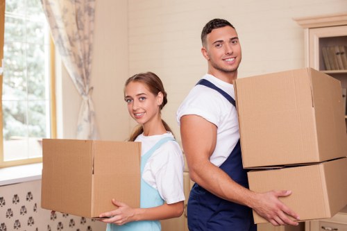 Unpacking and arranging belongings in a Hackney home